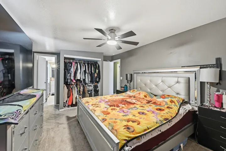 Bedroom #1 -  featuring a closet, light colored carpet, and a ceiling fan