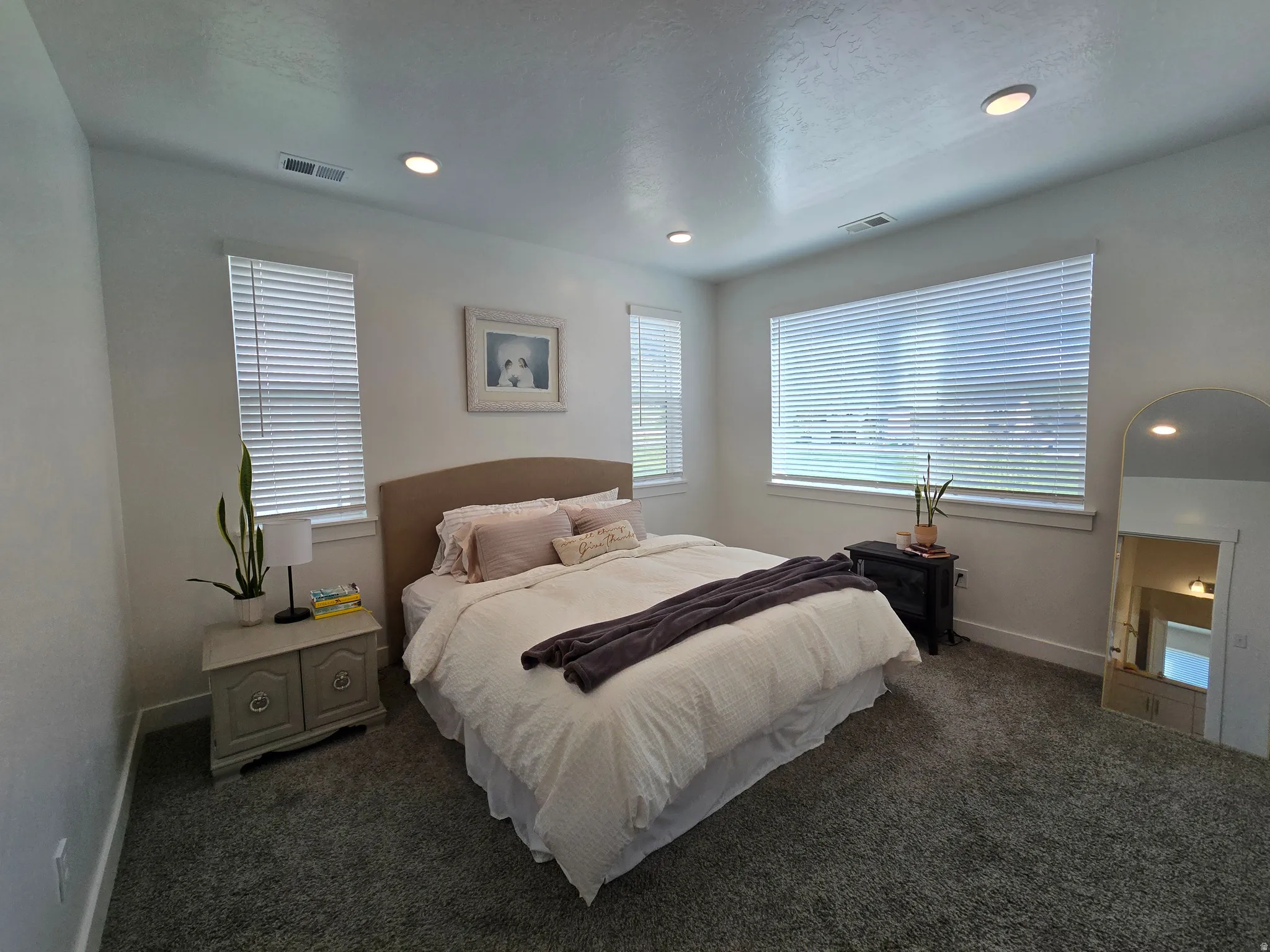 Bedroom with recessed lighting and dark carpet