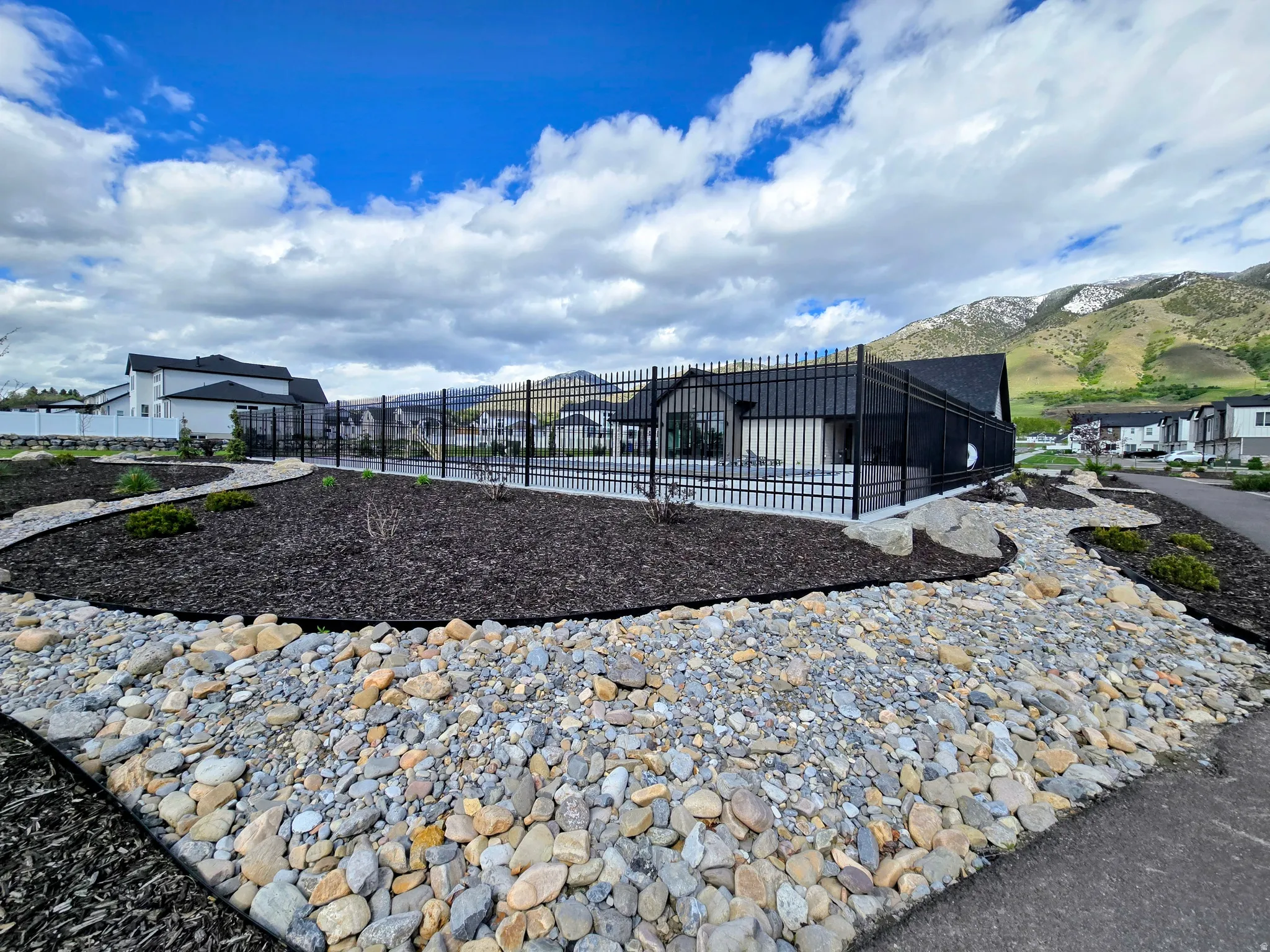 View of property's community featuring a mountain view and a sunroom