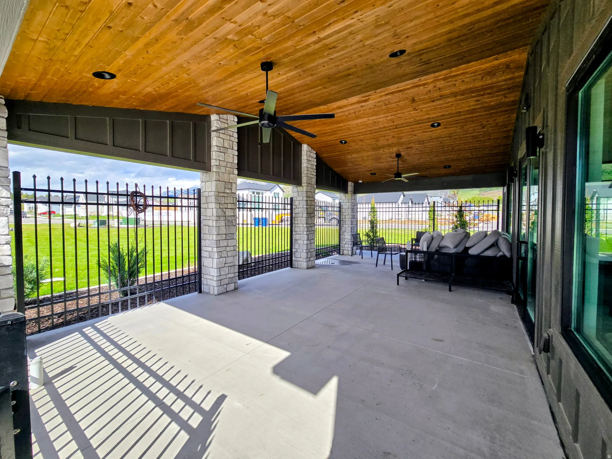 View of patio featuring ceiling fan