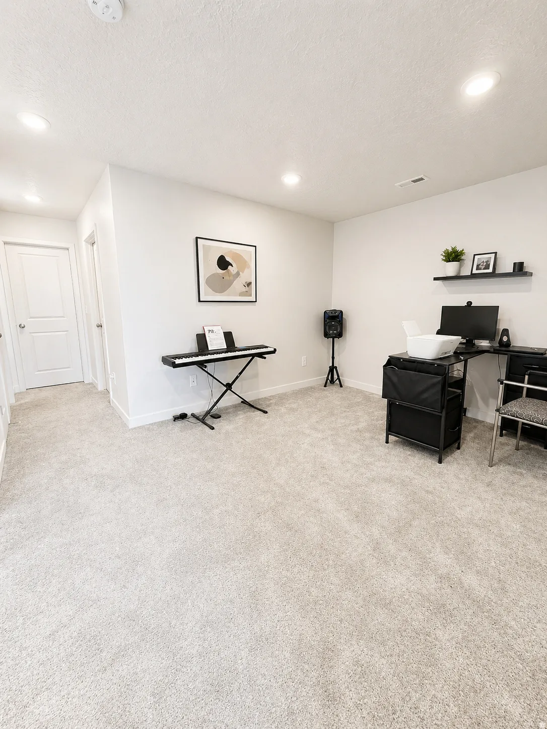 Sitting room with light carpet, recessed lighting, and a textured ceiling