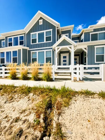 View of front of house with board and batten siding and a porch