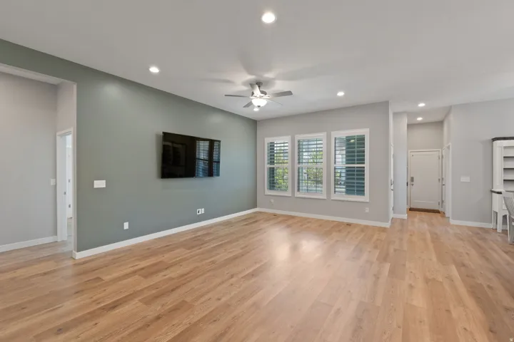 Unfurnished living room featuring recessed lighting, ceiling fan, and light wood finished floors