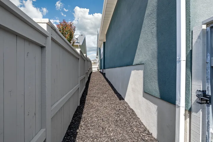 View of side of home featuring stucco siding