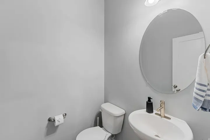Half bath with a sink and toilet