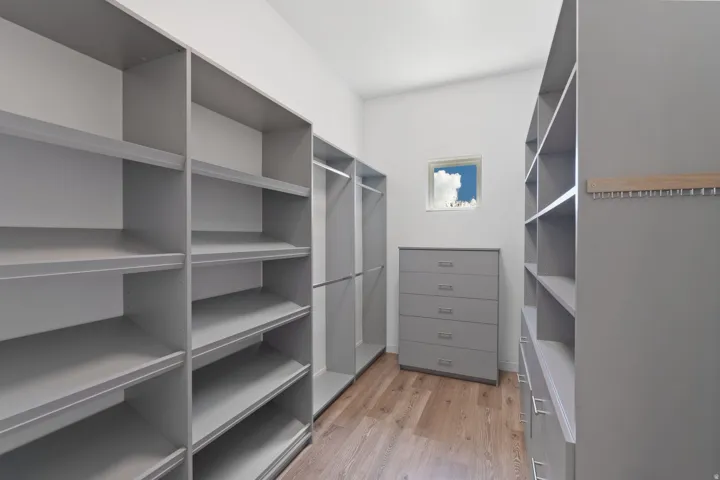 Walk in closet featuring light wood-style flooring