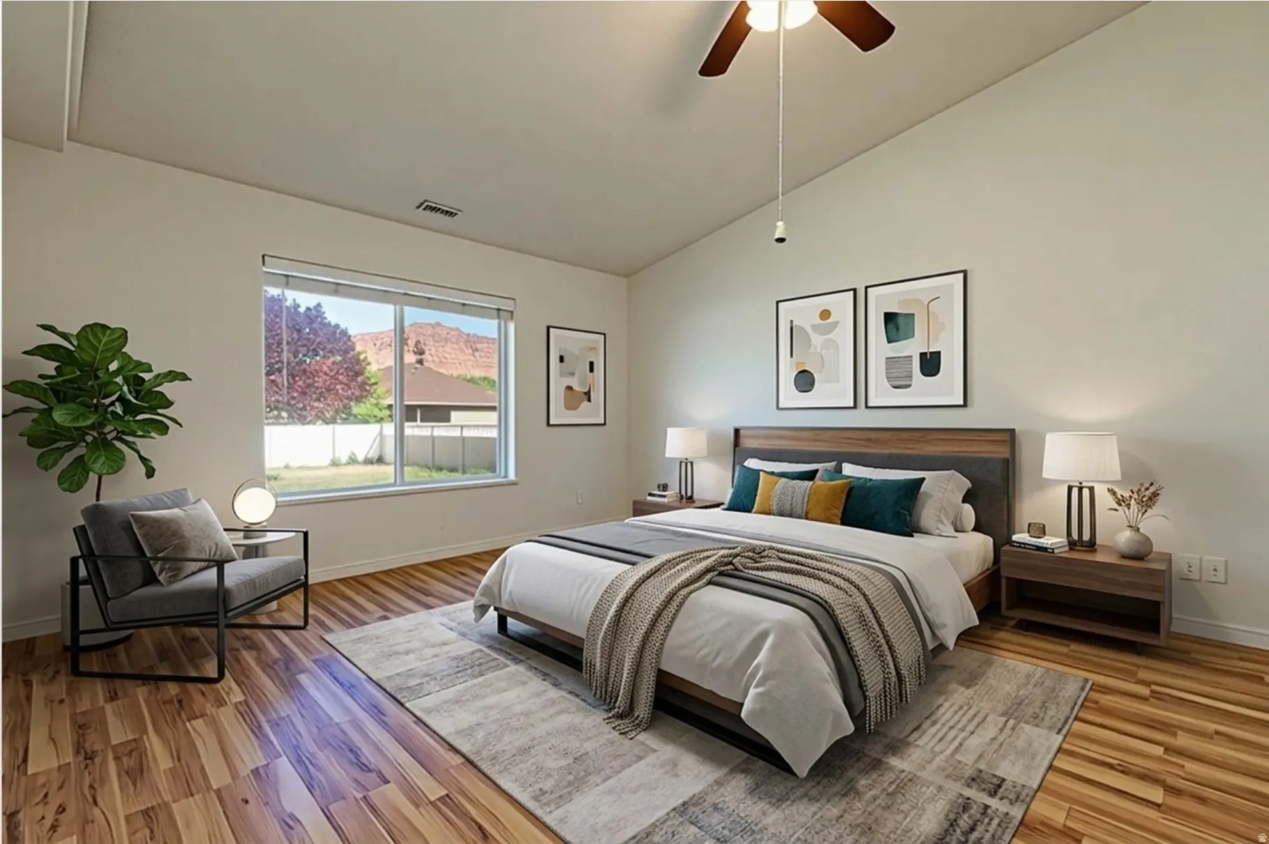 Bedroom featuring lofted ceiling, light wood-style flooring, and a ceiling fan