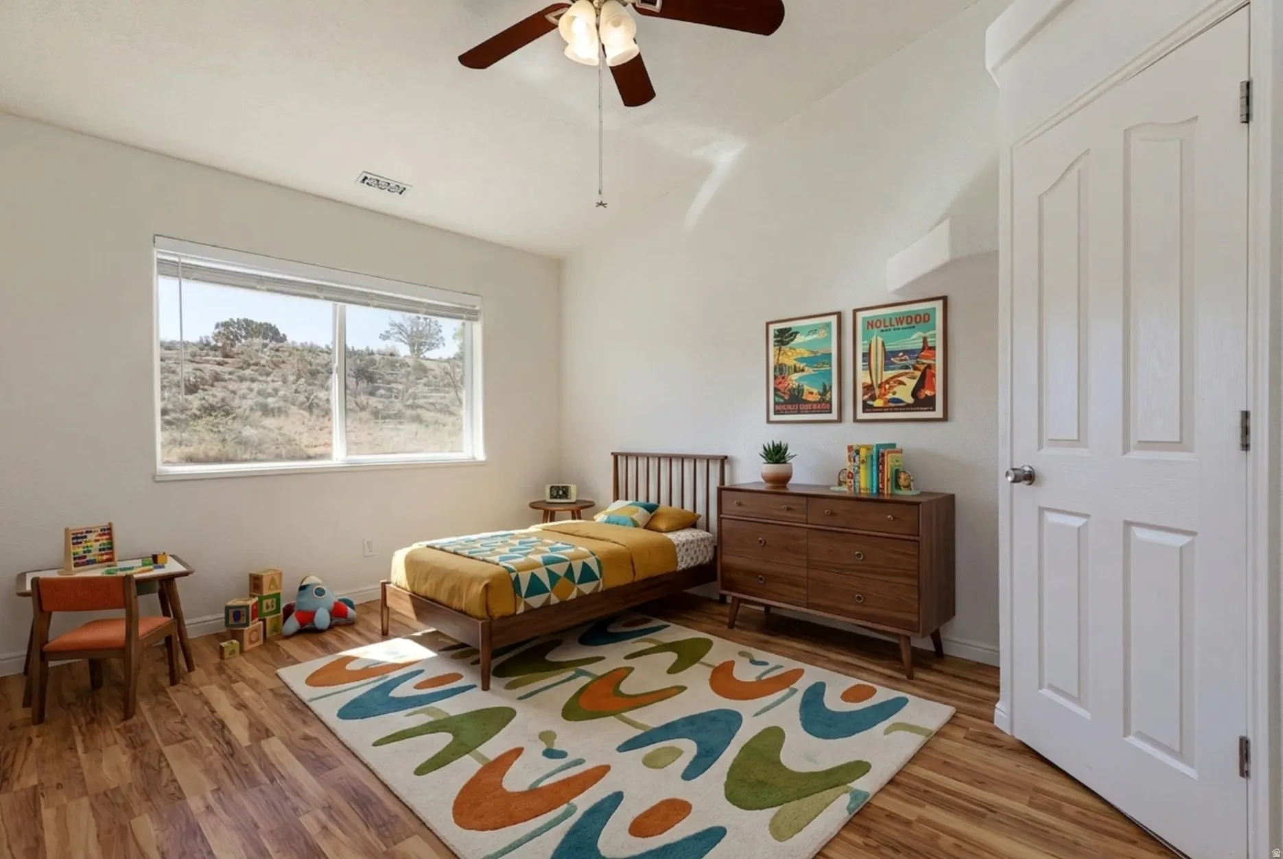 Bedroom featuring wood finished floors and ceiling fan