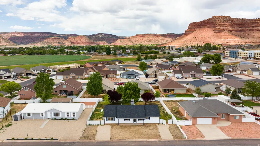 Aerial perspective of suburban area featuring a mountainous background