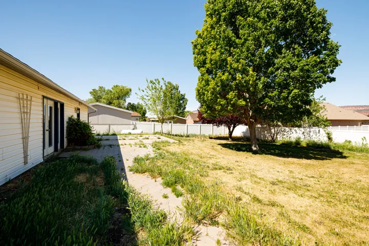 View of fenced backyard