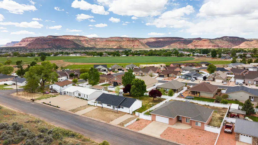 Aerial view of residential area with a mountain backdrop
