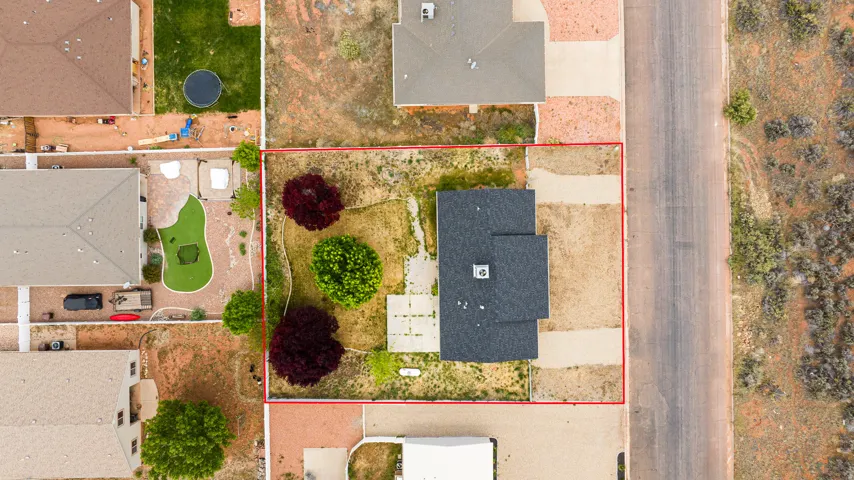 Aerial view of residential area with property parcel outlined