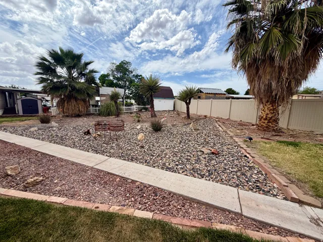Fenced yard with a shed