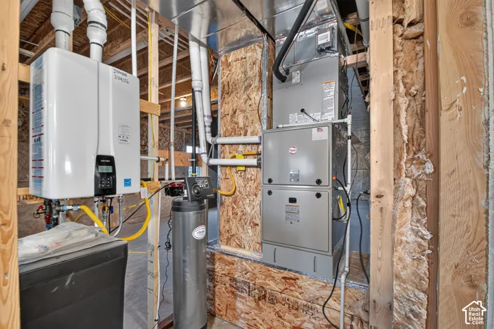 Tankless water heater and furnace unit visible