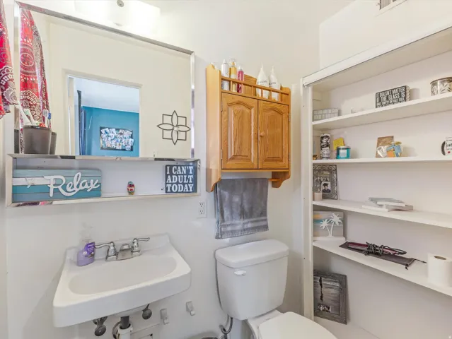 Half bathroom with a sink and toilet