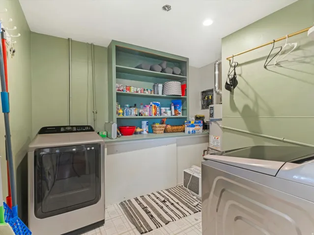 Laundry room featuring separate washer and dryer, light flooring, built in shelves, and recessed lighting