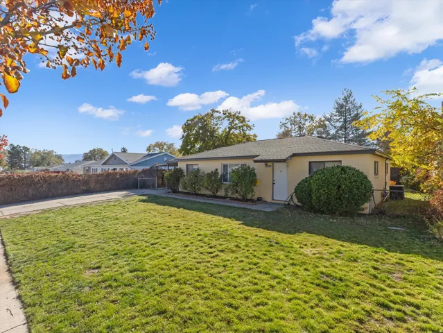 Ranch-style house featuring stucco siding
