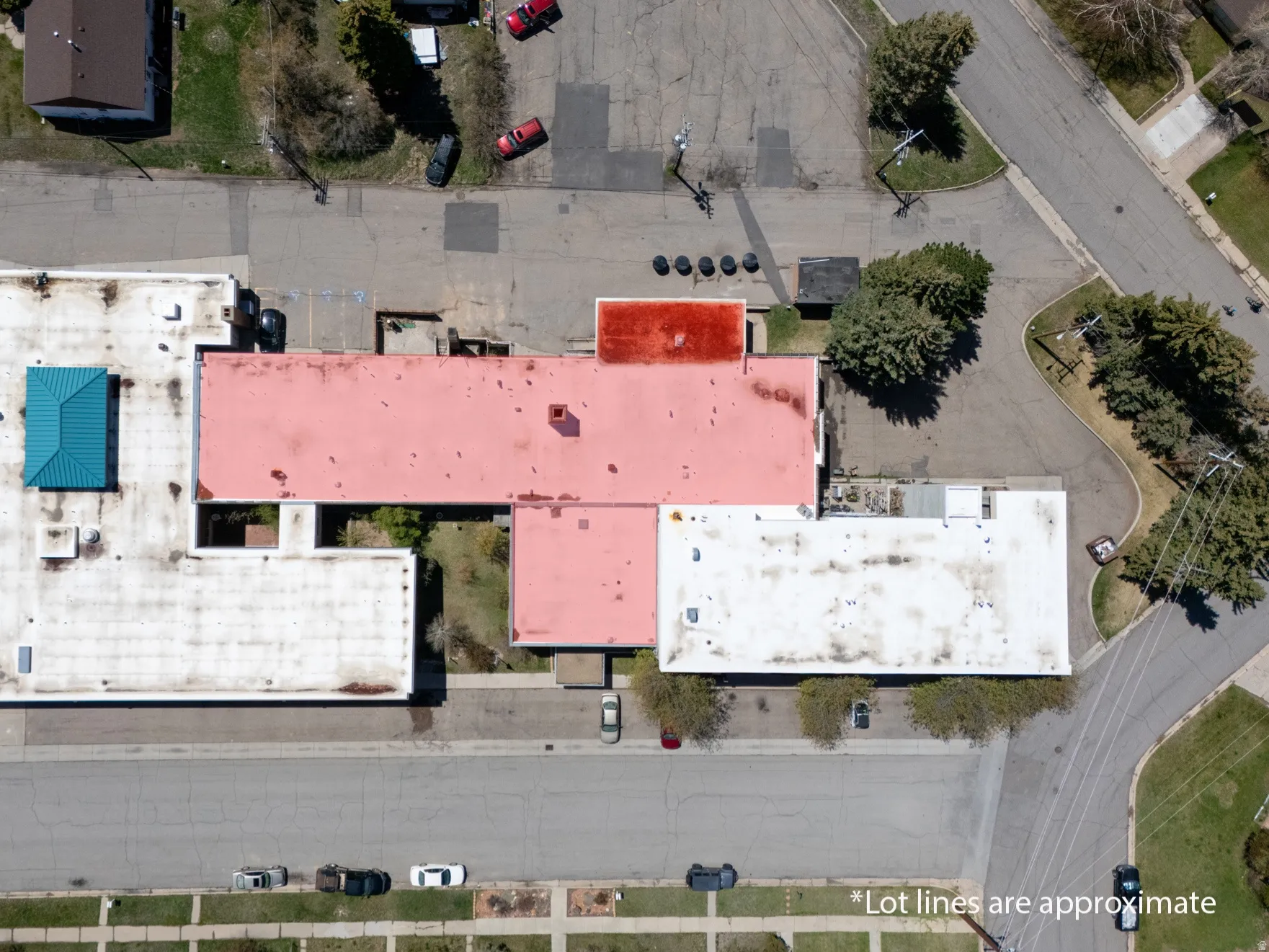 Aerial view showcasing a commercial property with multiple roof sections