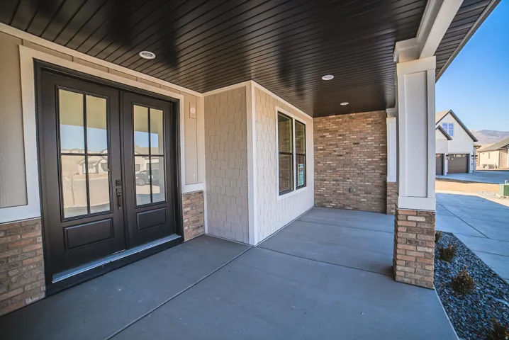 Property entrance with a porch and french doors