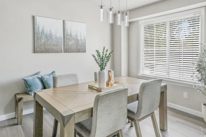Dining space featuring baseboards and light wood-style floors