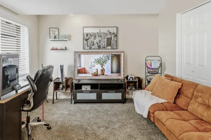 Office area with light carpet and baseboards