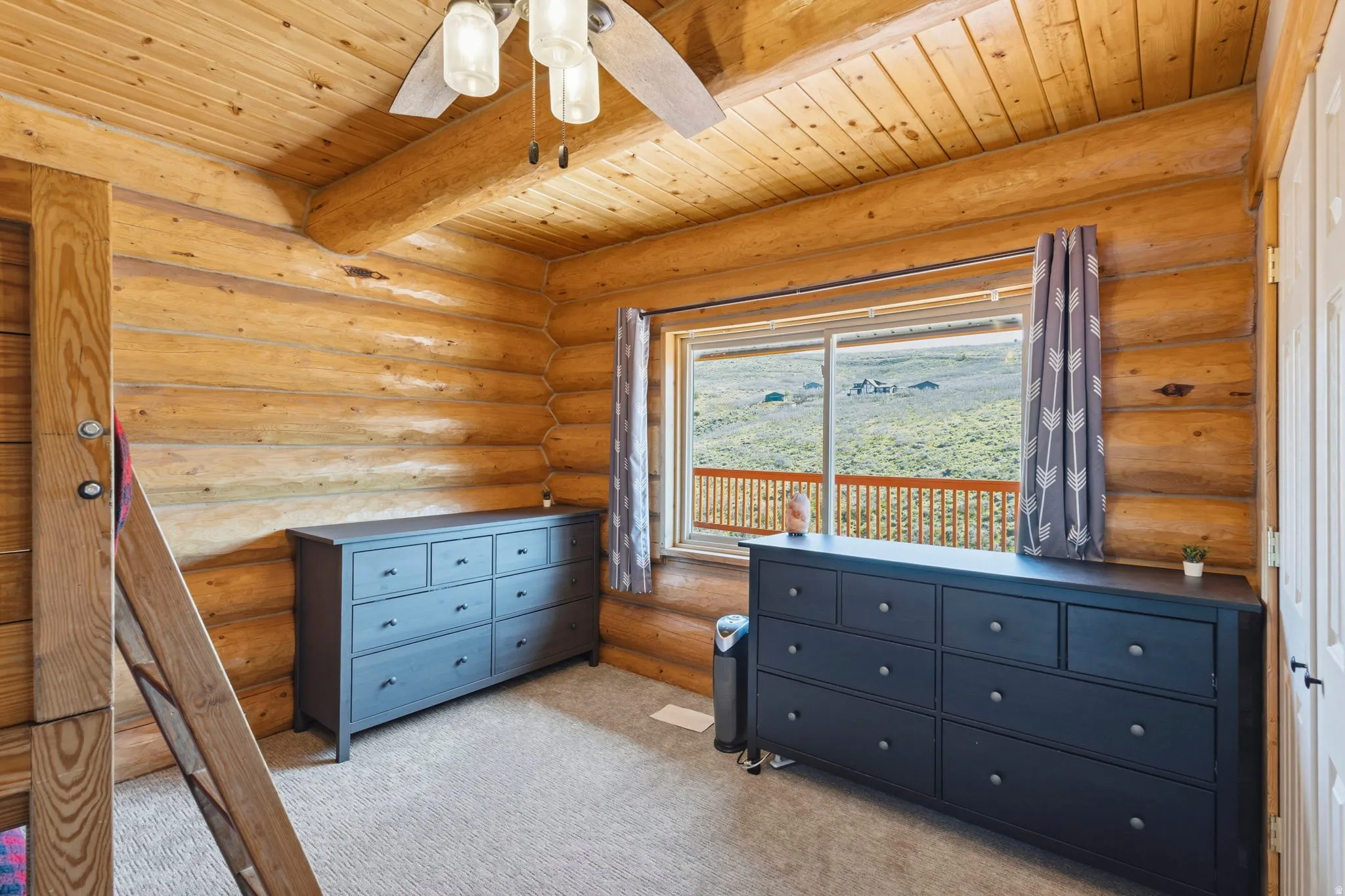 Bedroom featuring light carpet, rustic walls, ceiling fan, and a wood ceiling with exposed beams