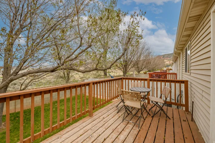 Expansive outdoor deck featuring wood flooring and railings