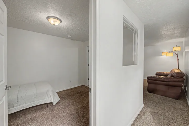 5th Interior room featuring neutral wall finishes and textured carpeting