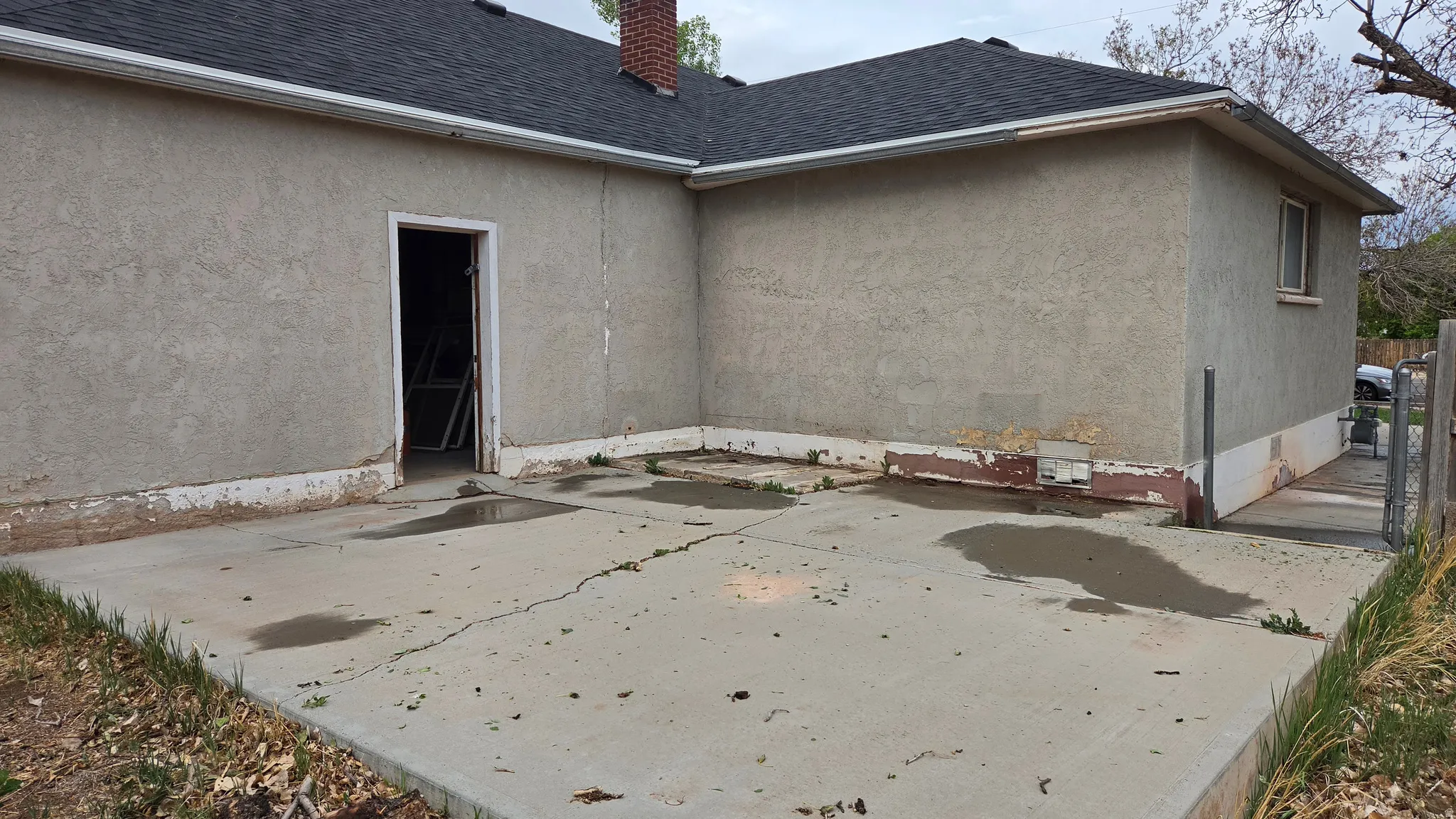 Concrete patio area featuring direct exterior access and an adjacent stucco exterior