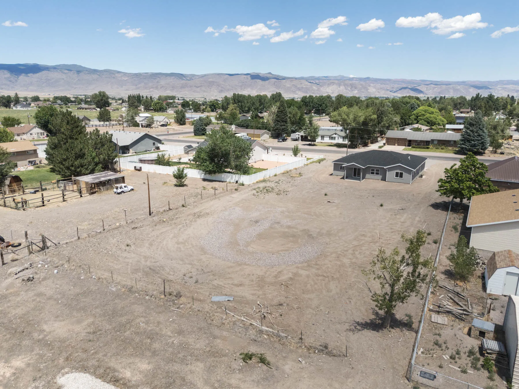 Spacious, undeveloped lot with a partially fenced perimeter