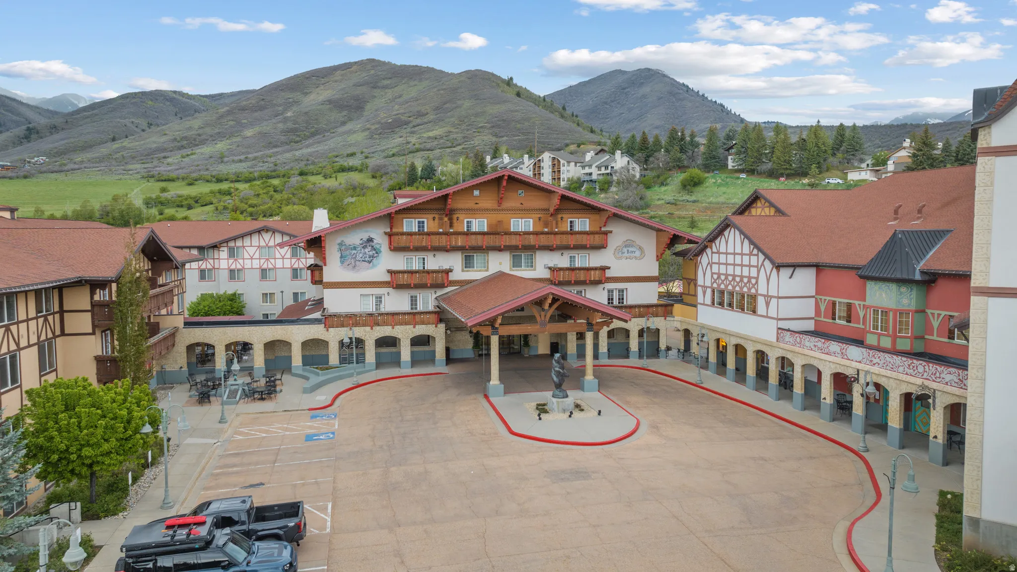 Traditional European-inspired architecture with distinctive red tile roofing and exposed timber detailing