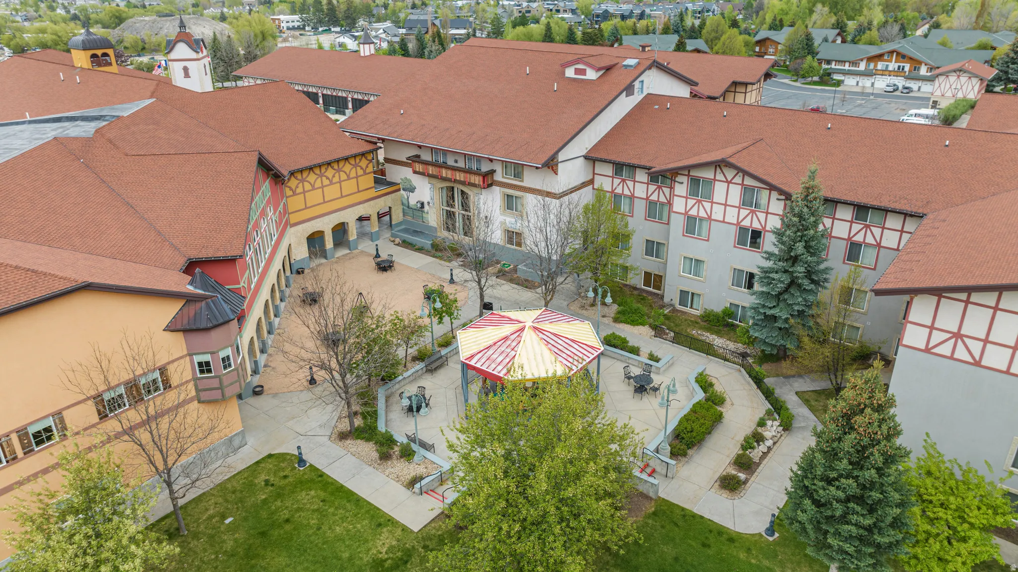 Multi-building complex featuring red tile roofs and traditional half-timbered architectural details
