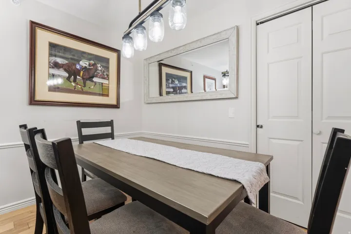 Dining area with light wood-type flooring and baseboards