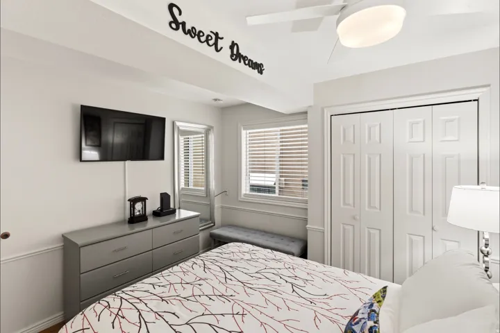 Bedroom with a closet and ceiling fan
