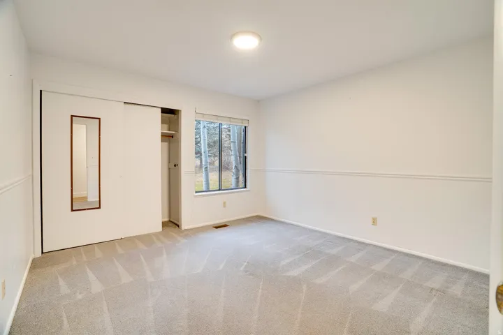 Neutral tone wall paint with chair rail molding