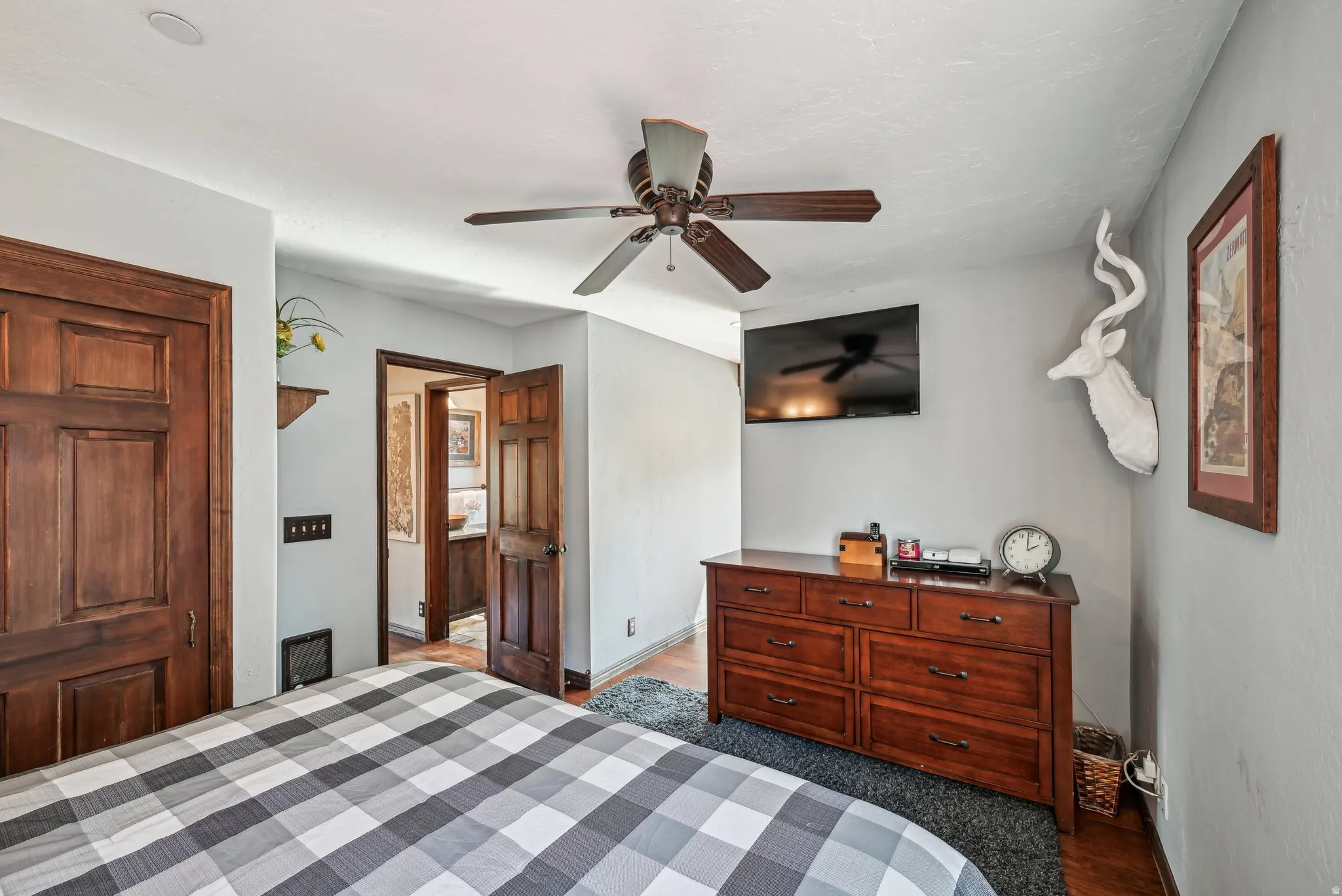 Bedroom featuring ceiling fan and baseboards