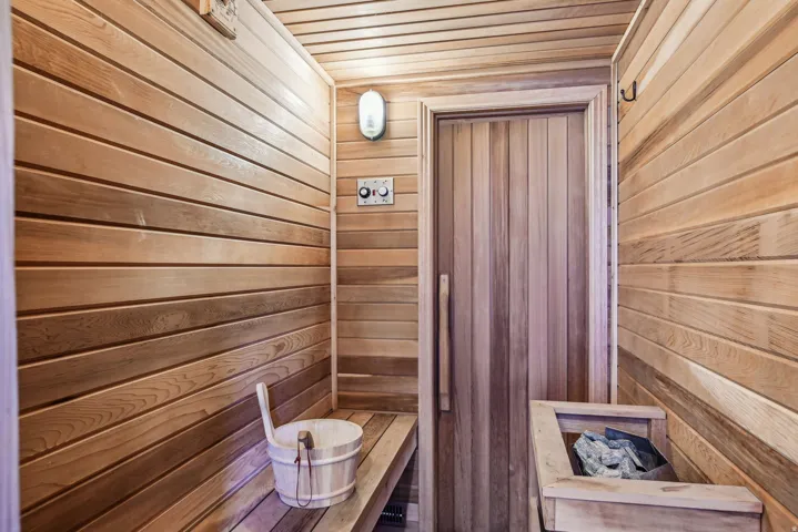 Relaxing sauna / steam room with wooden walls and wooden ceiling
