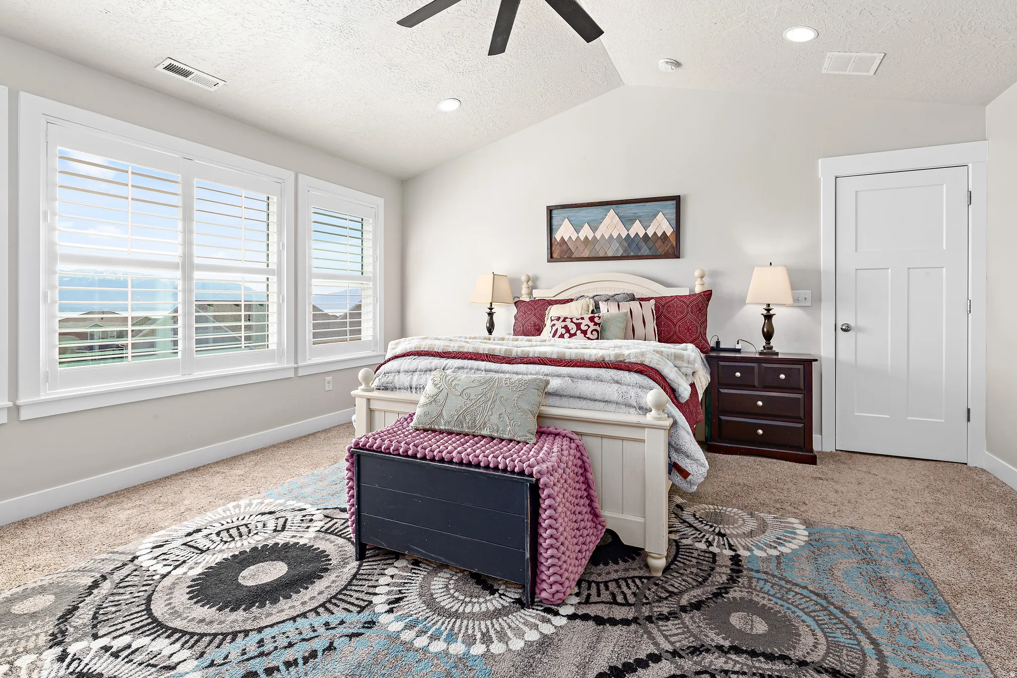 Vaulted ceiling with a ceiling fan, recessed lighting, and soft carpet flooring