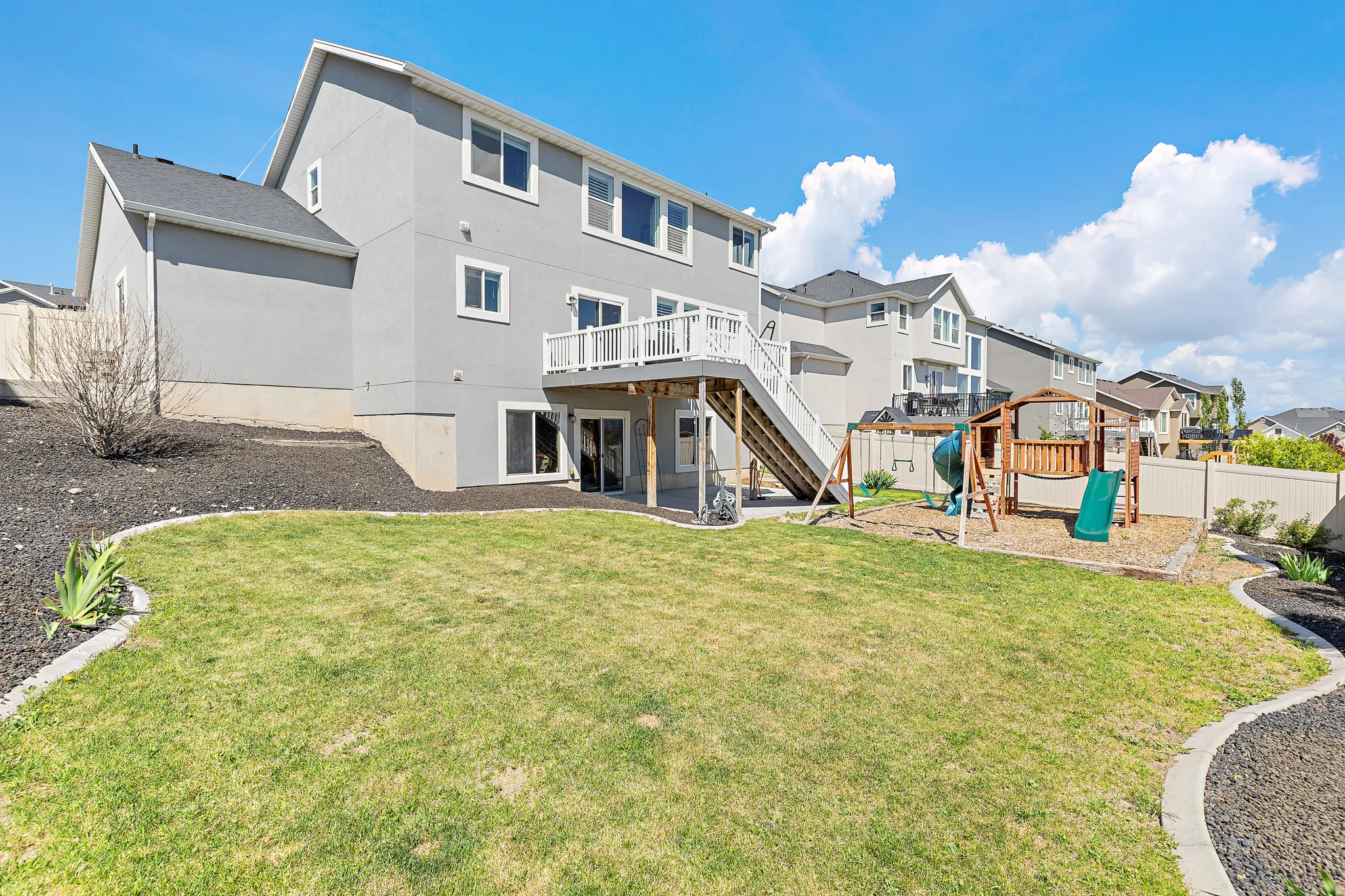 Rear exterior featuring a two-story design with a walk-out basement