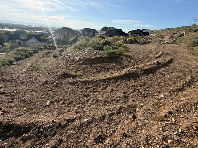 Undeveloped land featuring a natural, arid landscape with sparse vegetation