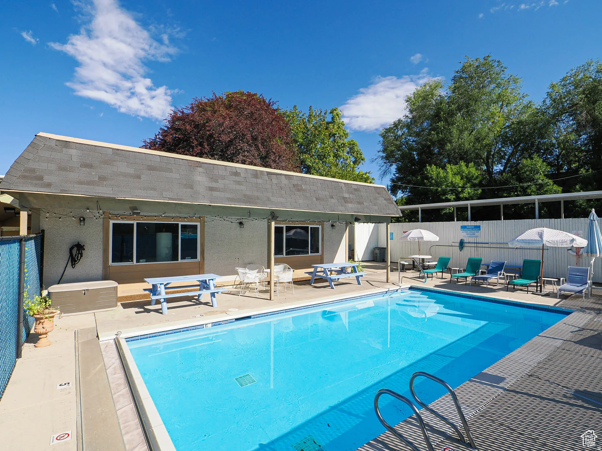 Community pool with a patio area