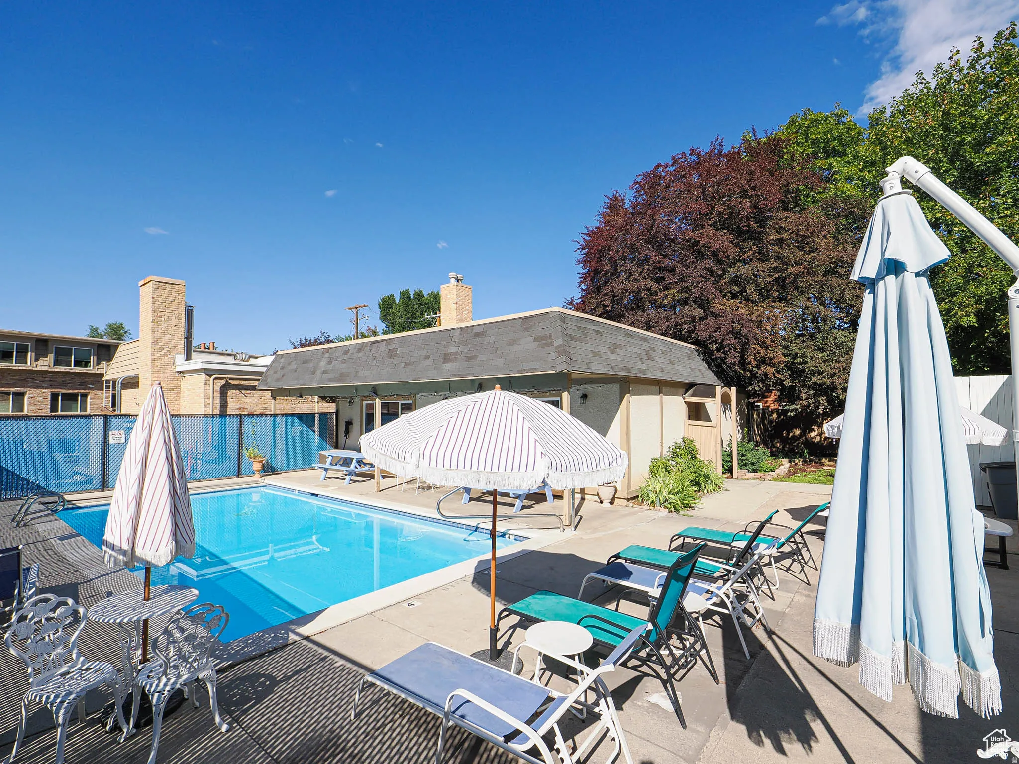 Community pool featuring a patio area