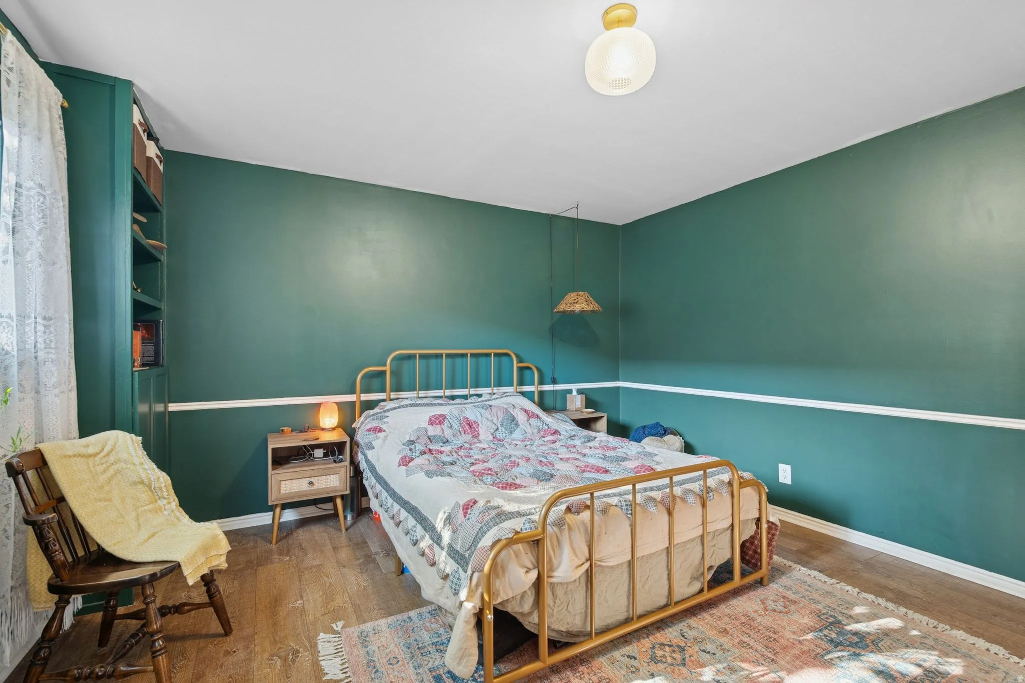 Bedroom with hardwood / wood-style floors