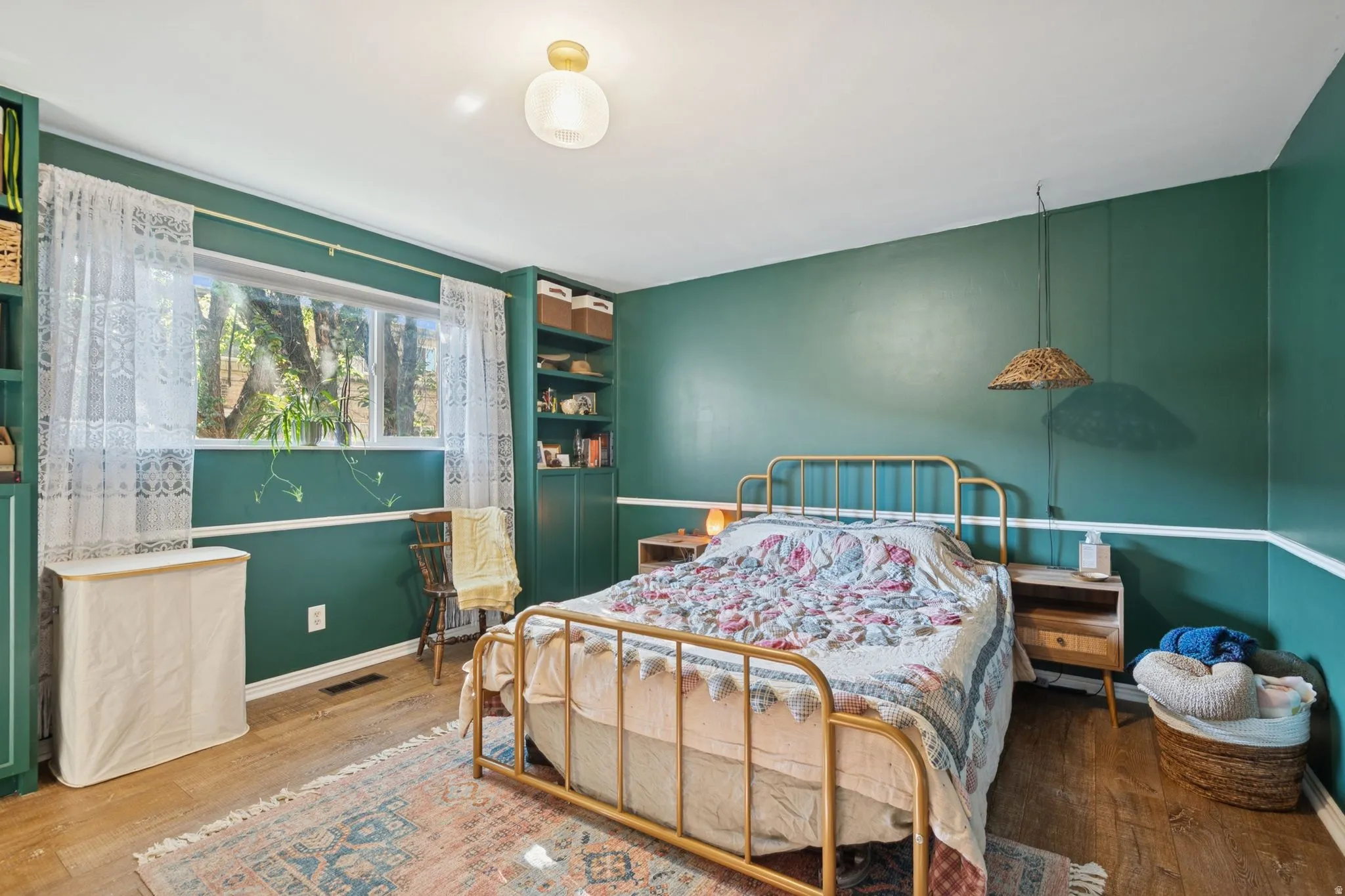 Bedroom with hardwood / wood-style floors