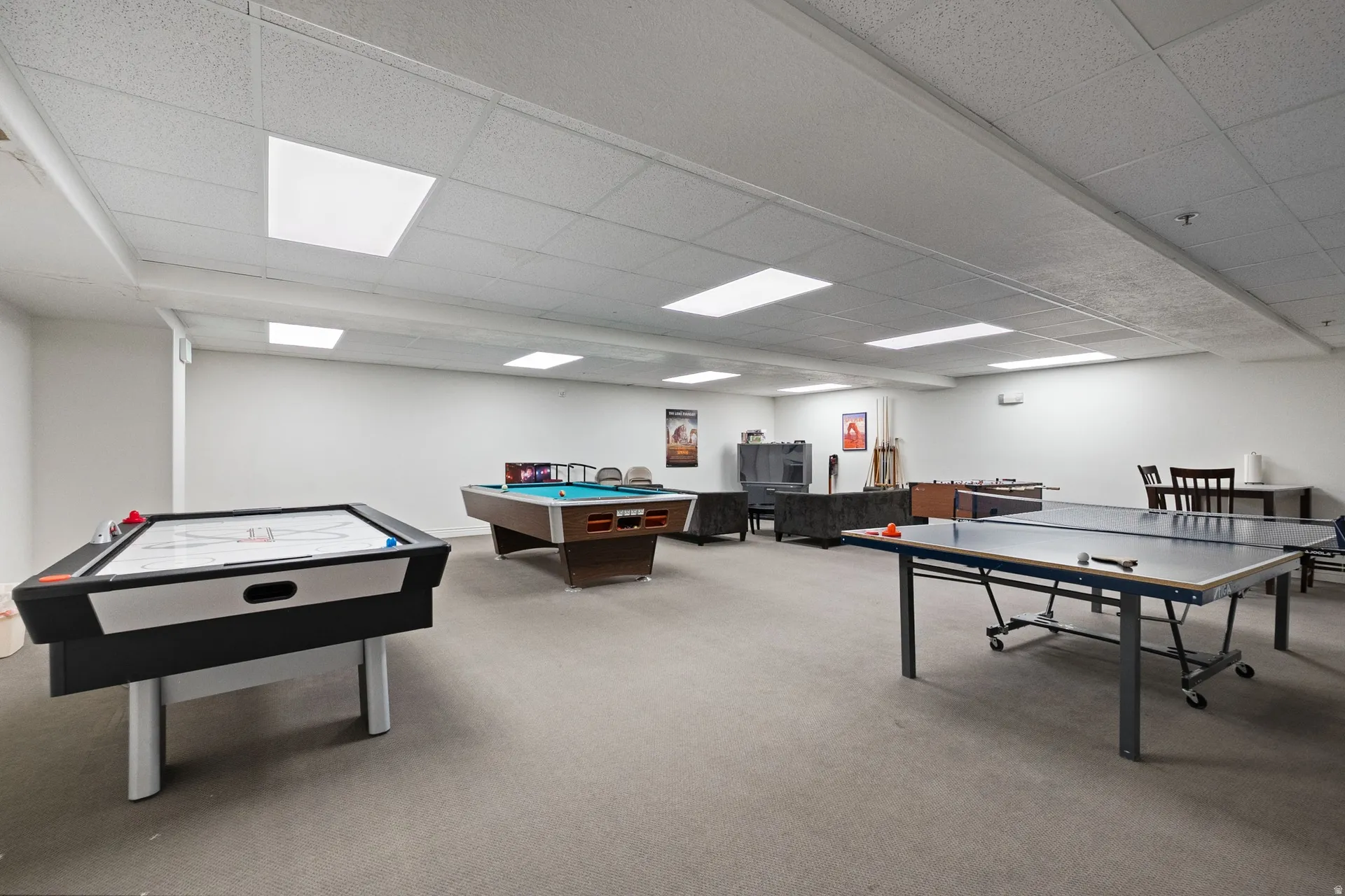 Game room with a drop ceiling and pool table