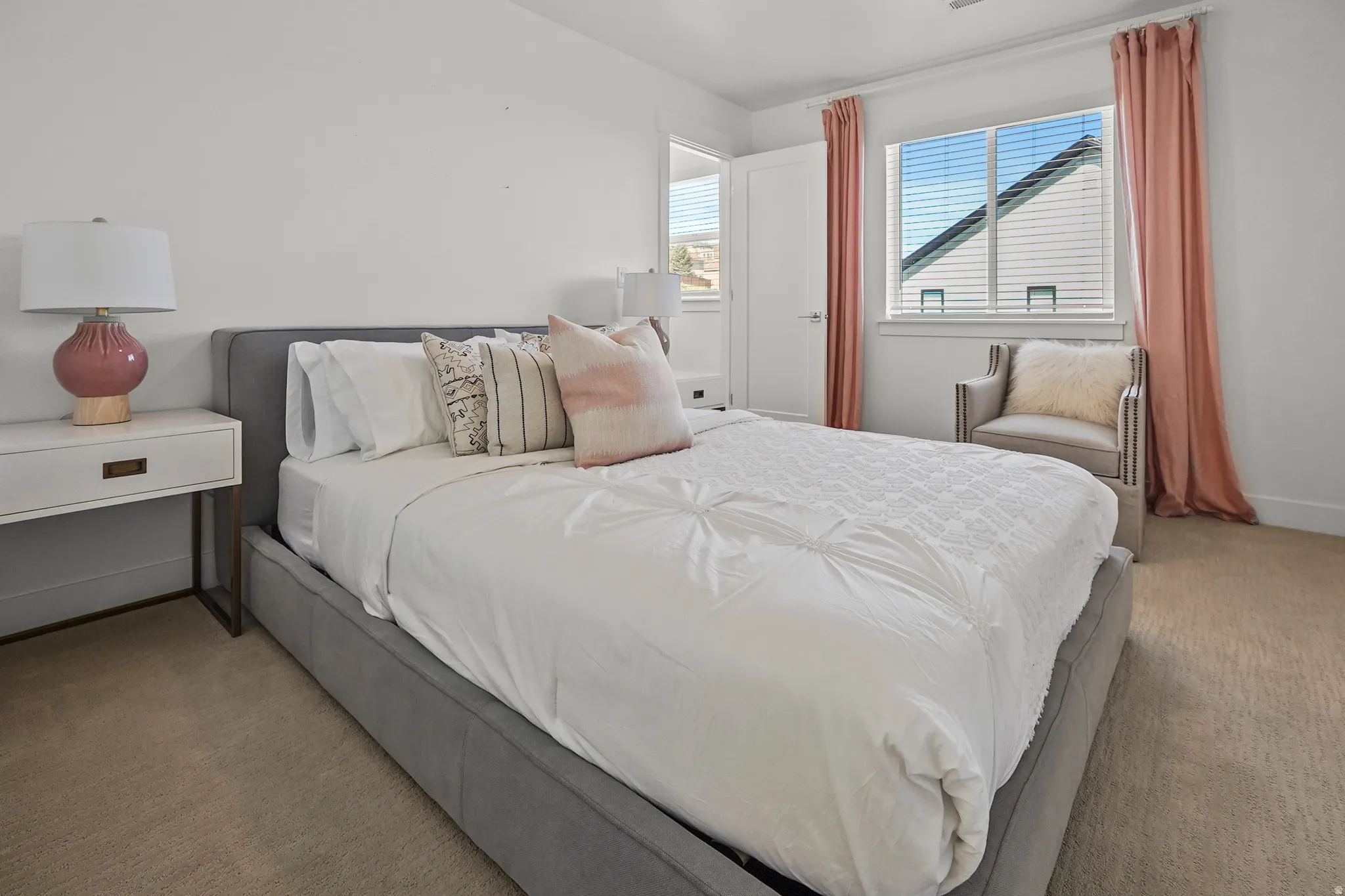 Bedroom featuring carpet floors and baseboards