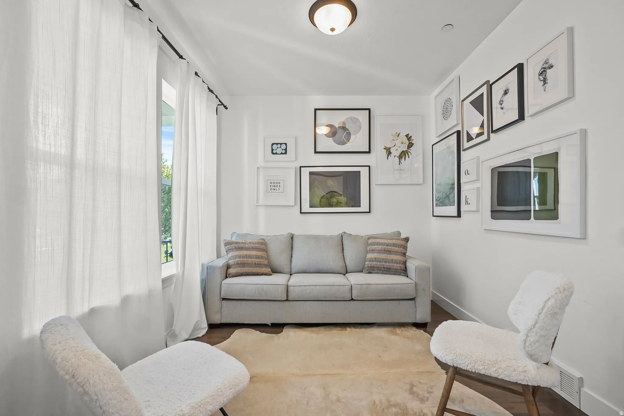 Living area featuring wood finished floors and baseboards