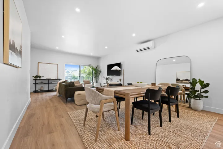Dining area featuring light wood-type flooring and recessed lighting