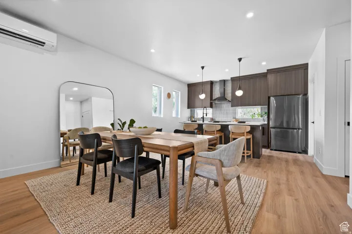 Dining area featuring recessed lighting and light wood-style floors
