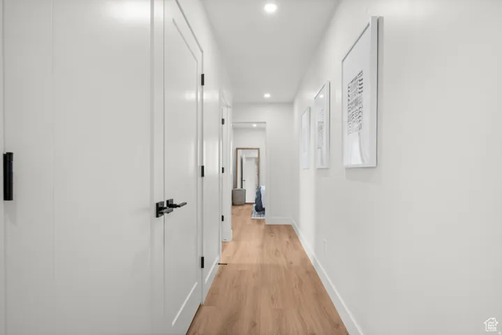 Corridor featuring recessed lighting and light wood finished floors